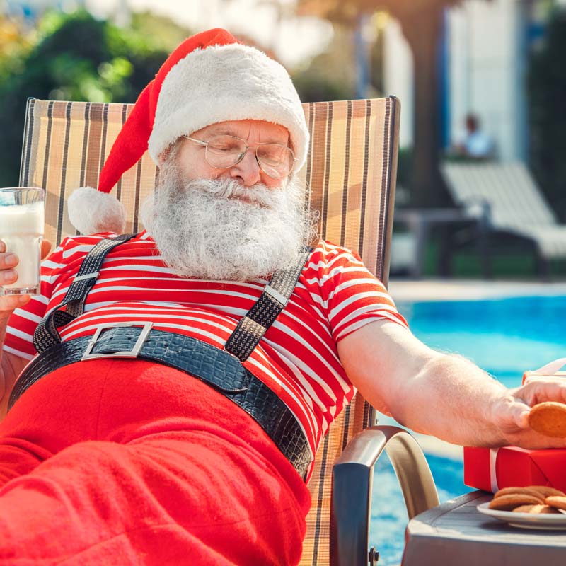 Santa relaxing by the pool